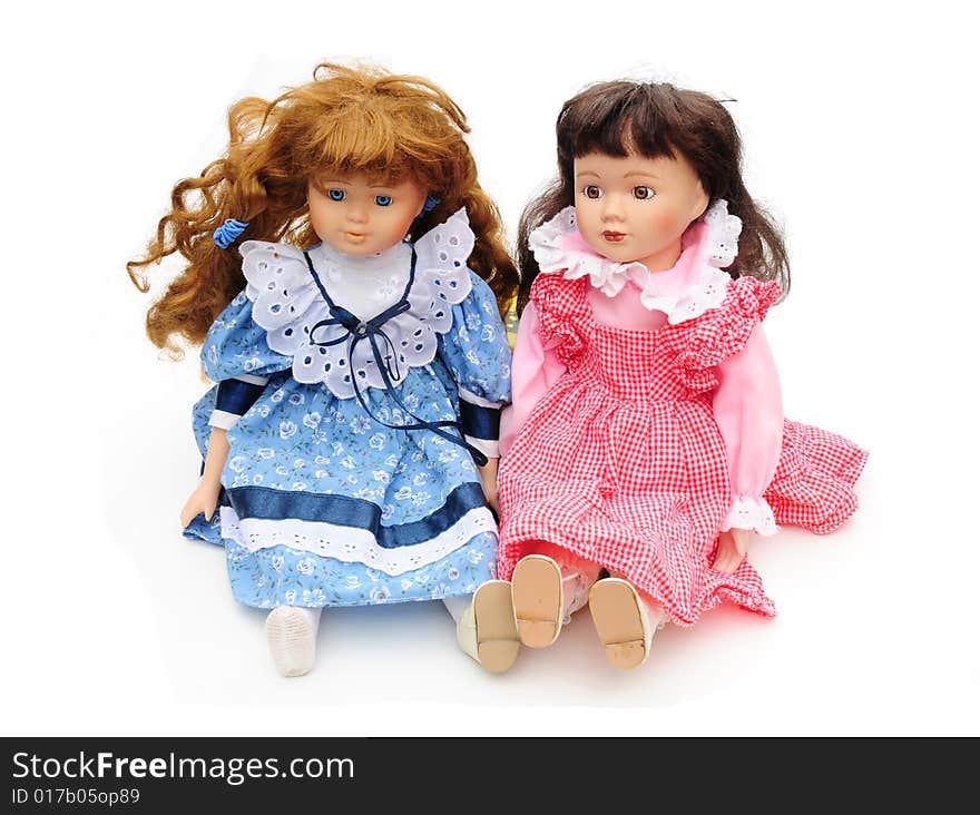 Shot of two vintage dolls on white