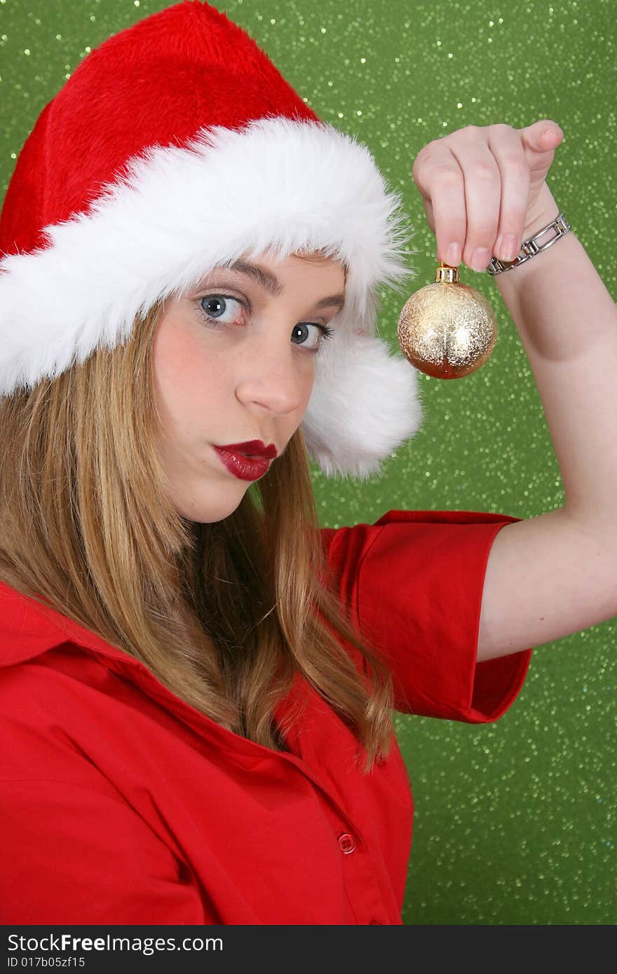 Teenager with red lips wearing a christmas hat. Teenager with red lips wearing a christmas hat