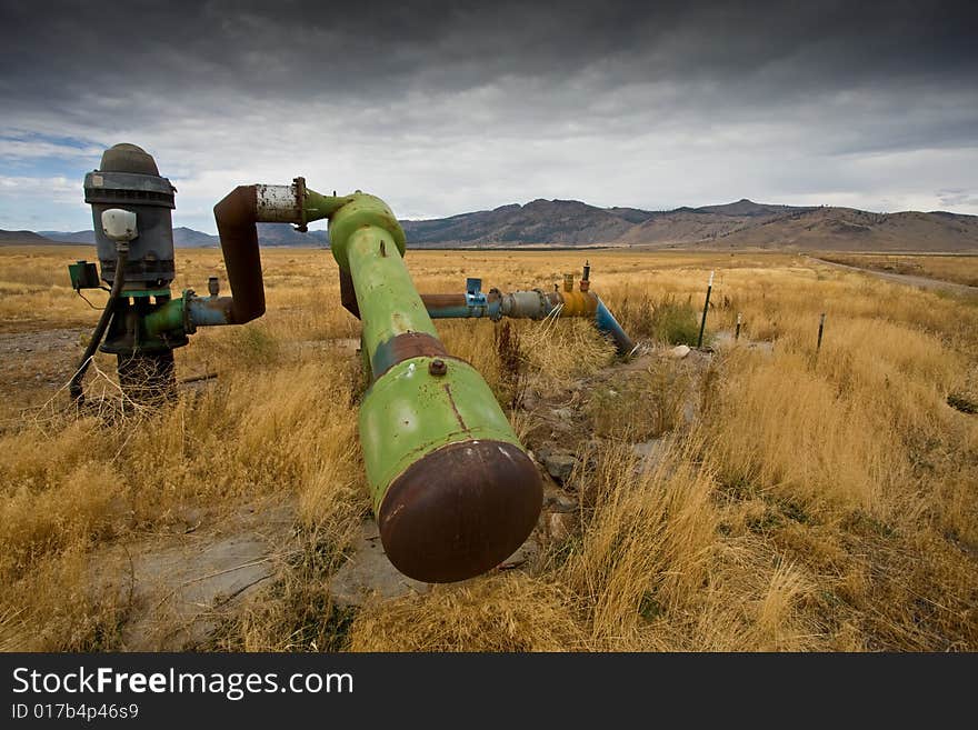 Abandoned irrigation pipes, in field of dried up vegetation. Abandoned irrigation pipes, in field of dried up vegetation