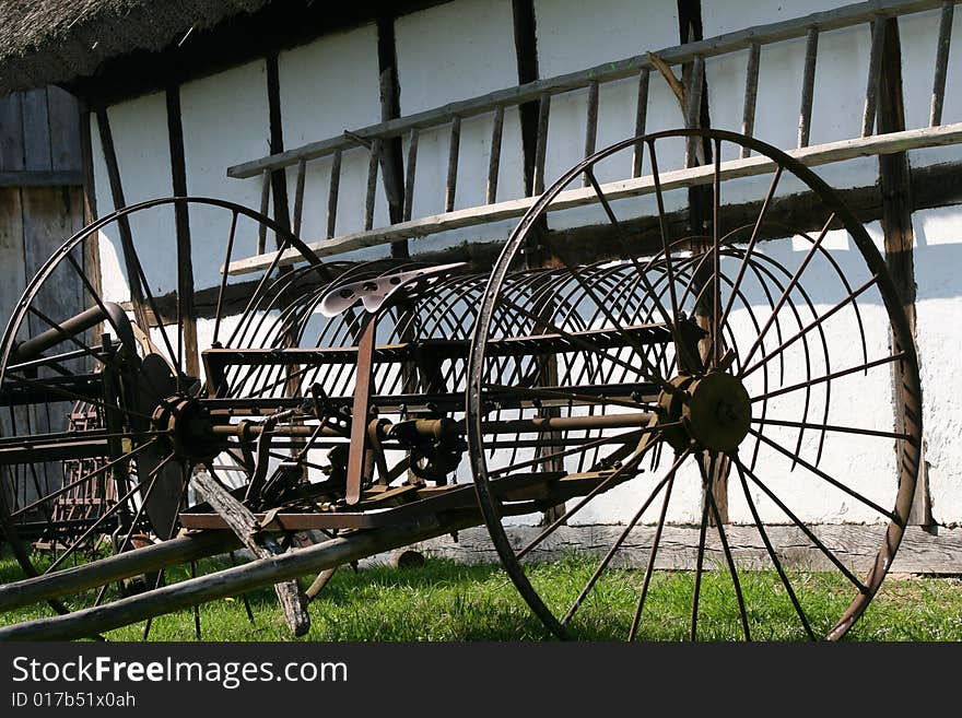 Agricultural machinery and ladder in the village