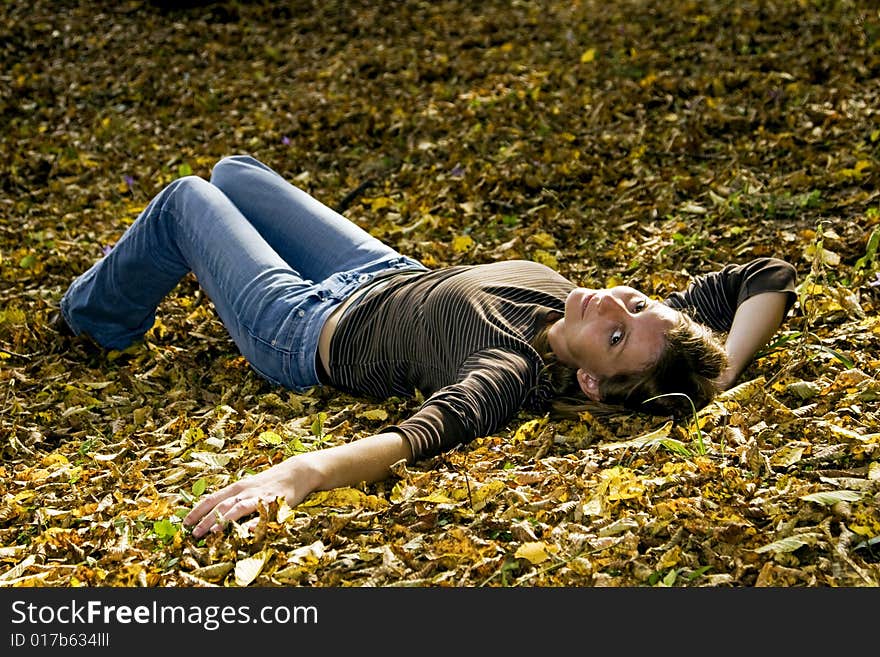 Young Woman In Autumn Forest