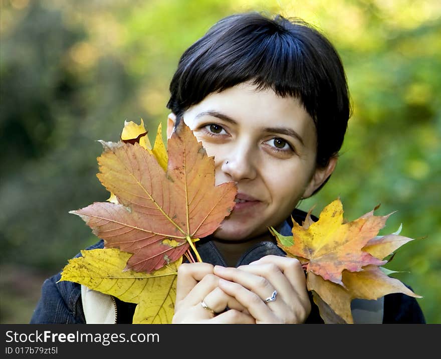 Young Woman With Maple Leaves