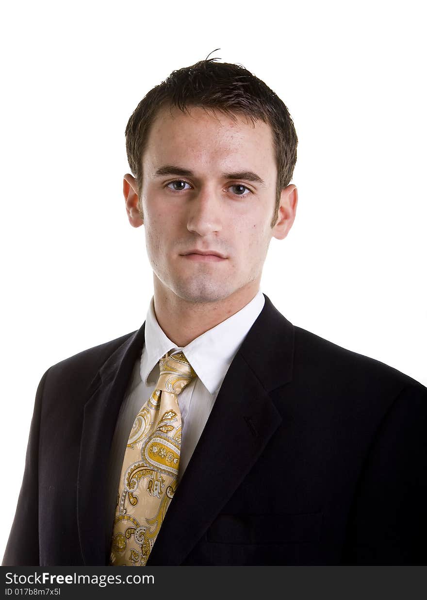 Earnest Young Businessman In Gold Tie