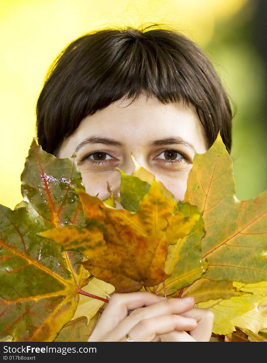 Young Woman With Maple Leaves