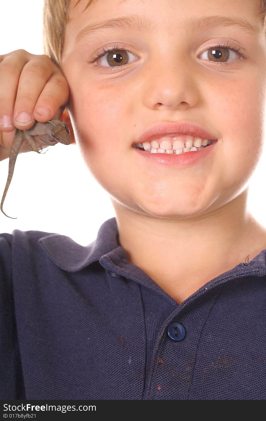 Happy little boy showing off his lizard vertical isolated on white