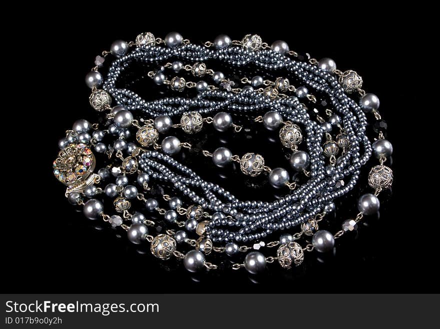 Silver imitation jewelry on black