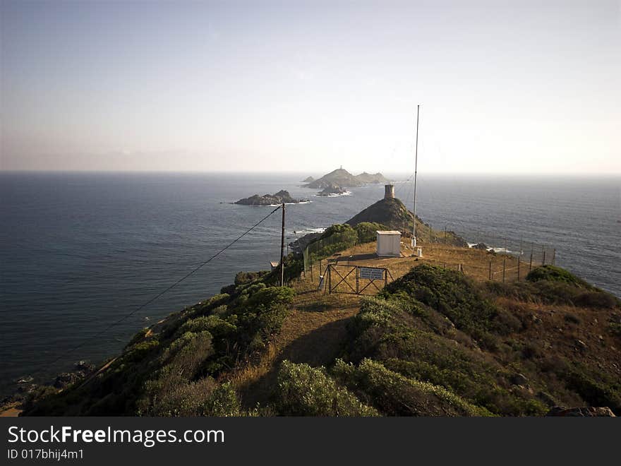 Mediterranean Coastline.
Sanguinaire islands and Parata Tower in Corsica, France. Near Ajaccio in the Mediterranean Sea.