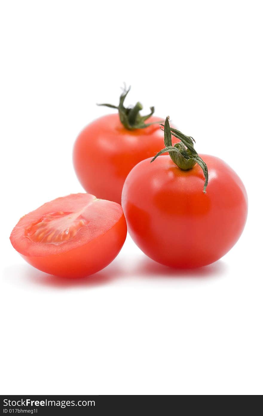 Ripe tomatoes cherry isolated on white. Ripe tomatoes cherry isolated on white