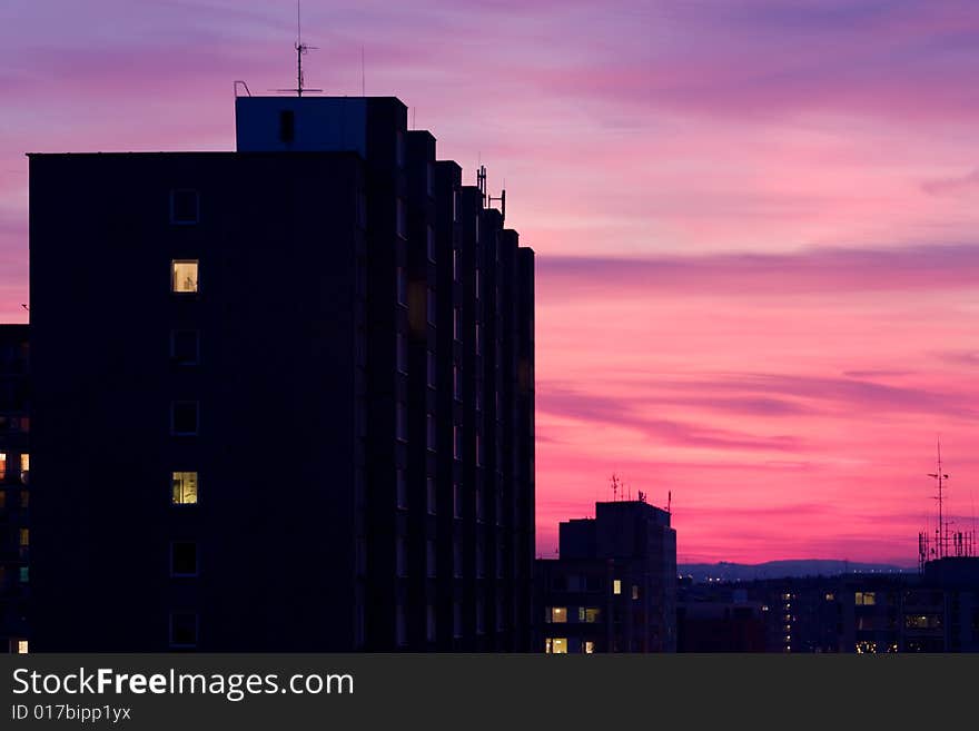 Red night sky above a city. Red night sky above a city.