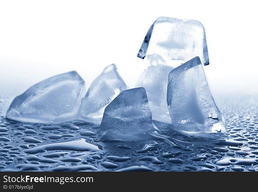 Melting ice cubes toned blue