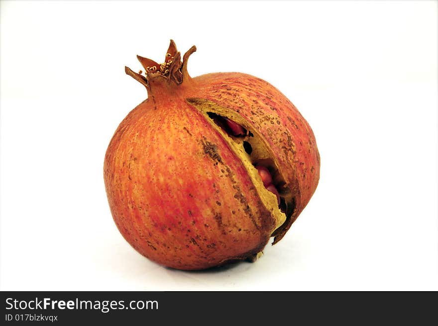 Single pomegranate on white background