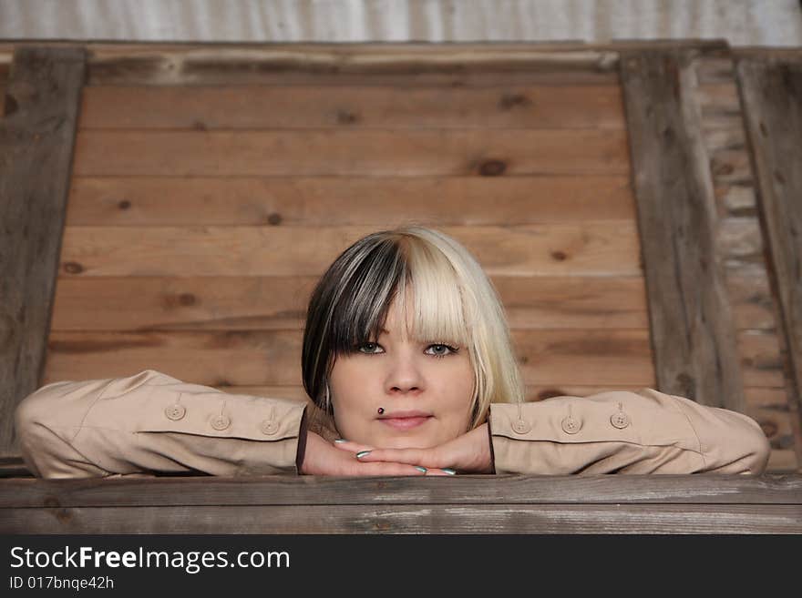 Beautiful young woman, fashion model, black and blond hair in industrial location