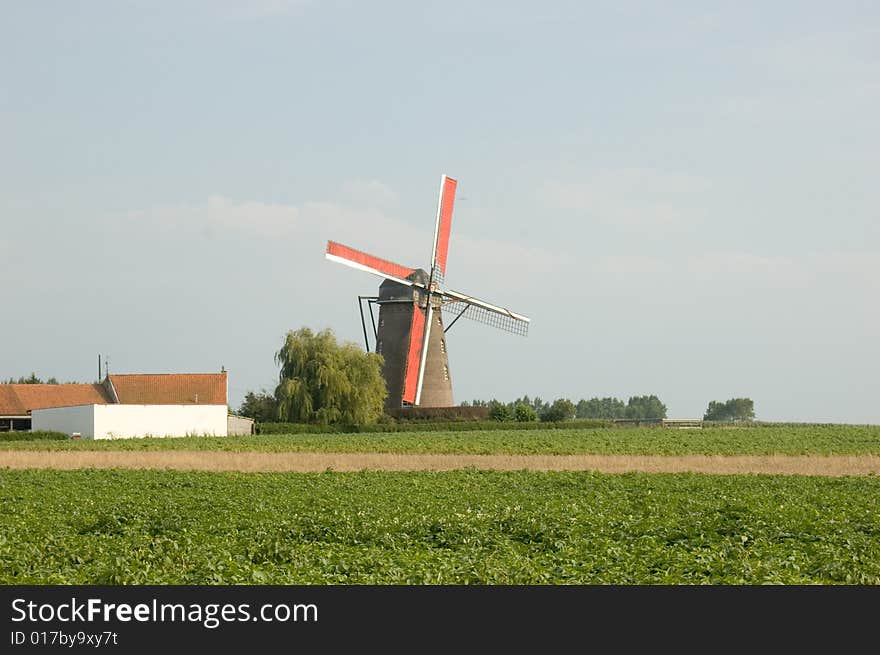 This windmill was standing on the outskirts of a town near the French Belgium boarder. The sails were red and reminded me of a famous belgium beer brand. This windmill was standing on the outskirts of a town near the French Belgium boarder. The sails were red and reminded me of a famous belgium beer brand.