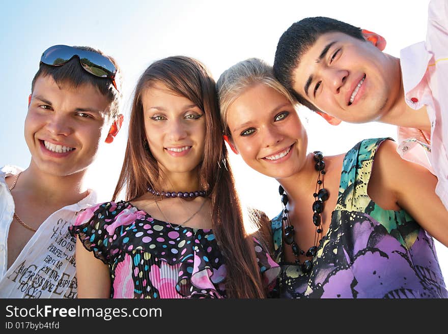 Portrait of group of friends on light