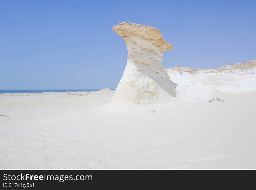 Remote desert landscape with interesting sandstone formations formed millions of years ago. Remote desert landscape with interesting sandstone formations formed millions of years ago.