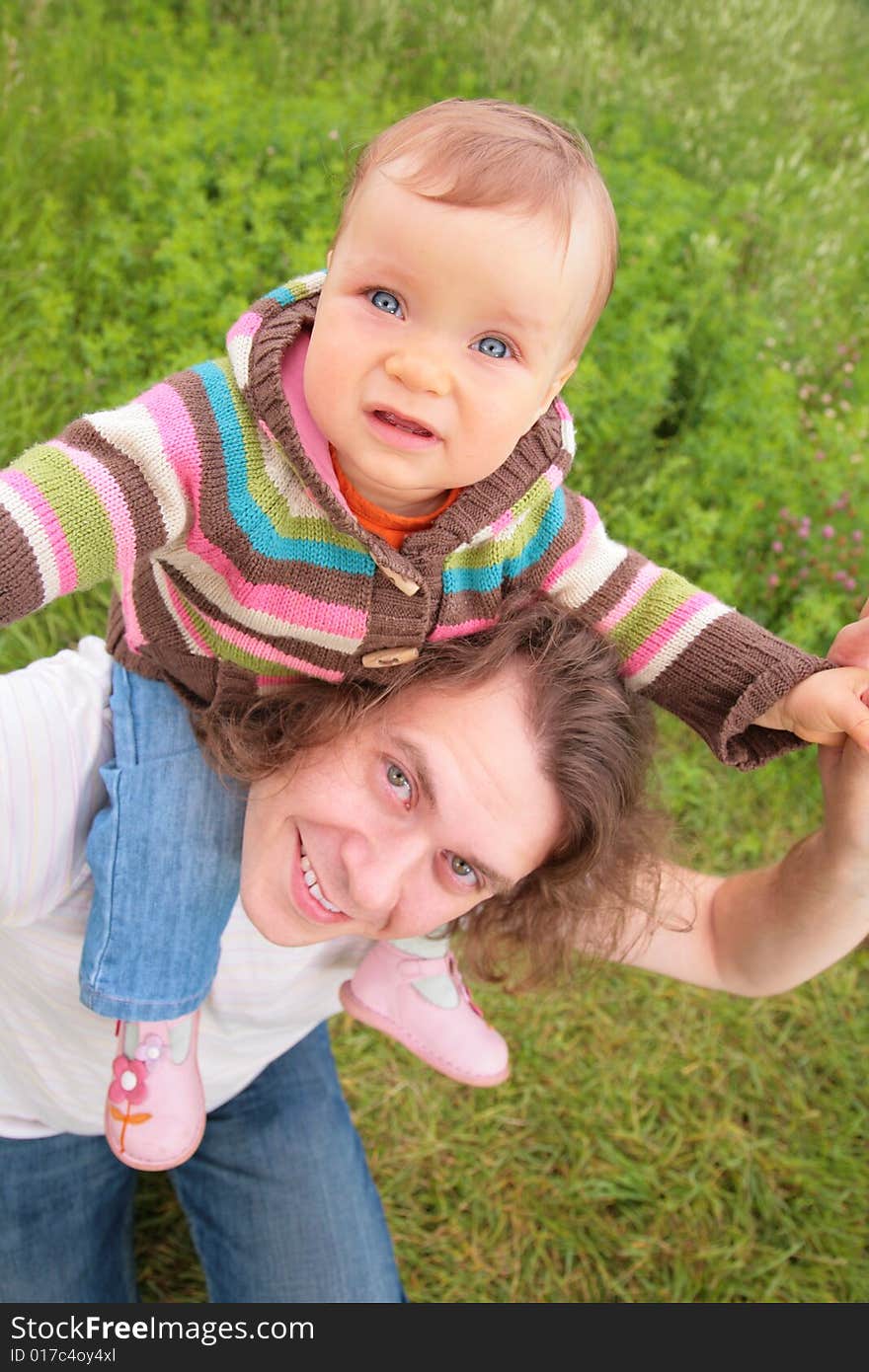 Baby on father`s shoulders