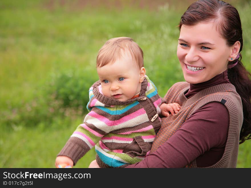 Mother with baby on nature, summer