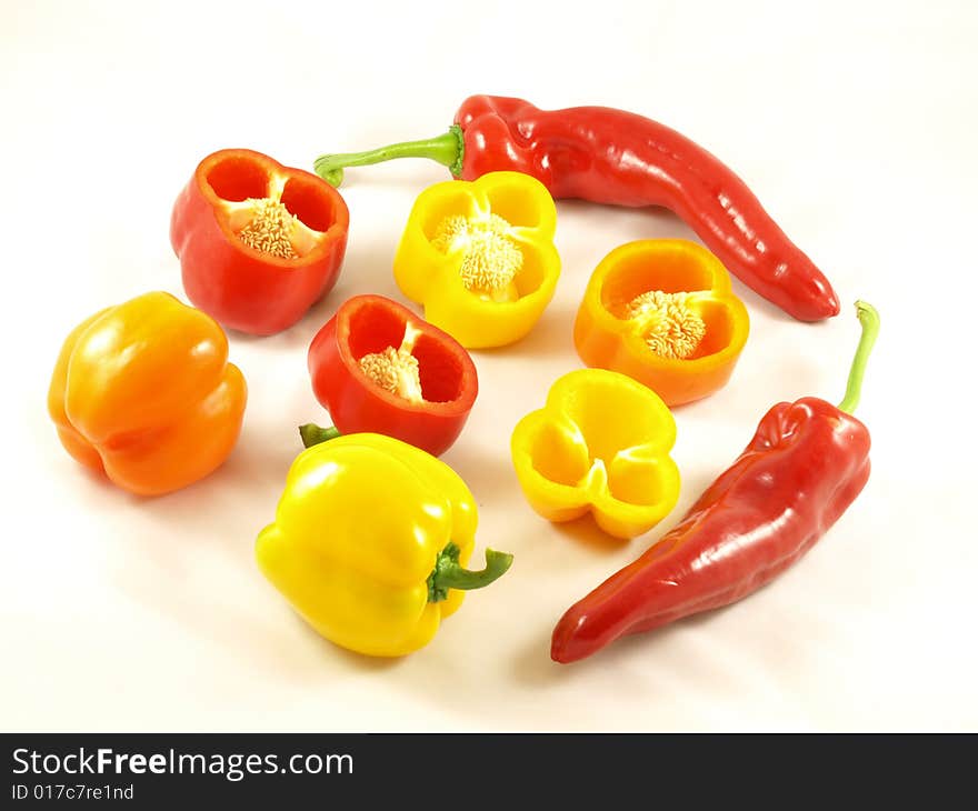 Composition of red,yellow and orange peppers with two chilies. Composition of red,yellow and orange peppers with two chilies