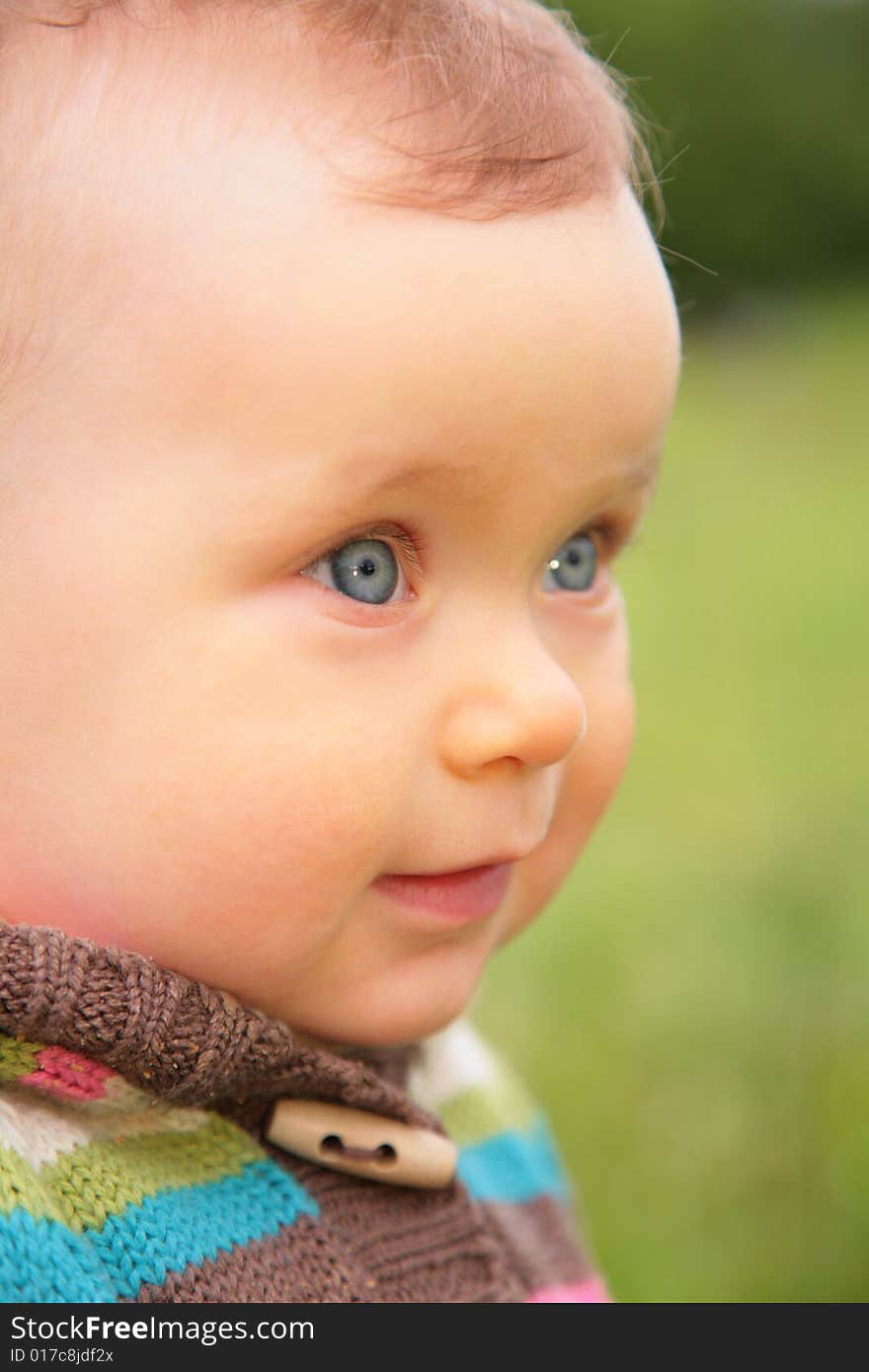 Closeup portrait of  baby on nature