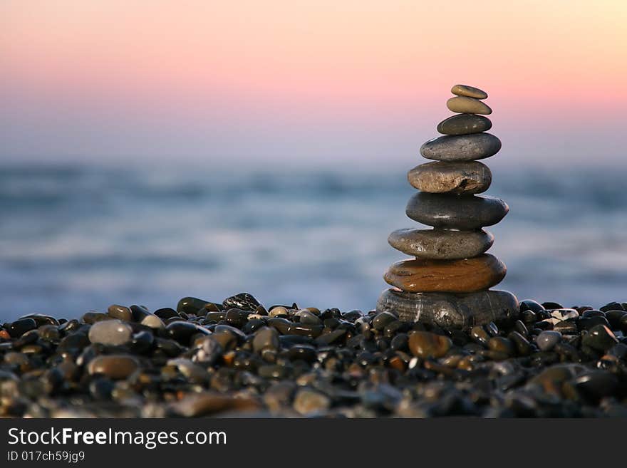 Small pyramid from stones on seacoast