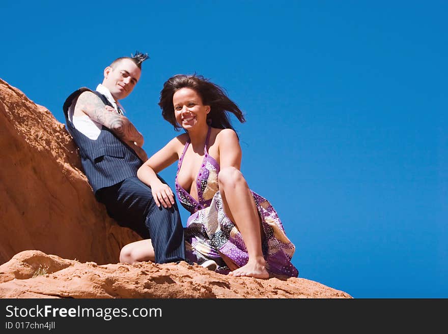 Attractive couple posing in fashionable dresses. Attractive couple posing in fashionable dresses