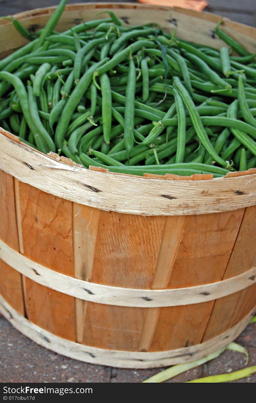 Green beans in a bushel basket at the market. Green beans in a bushel basket at the market.