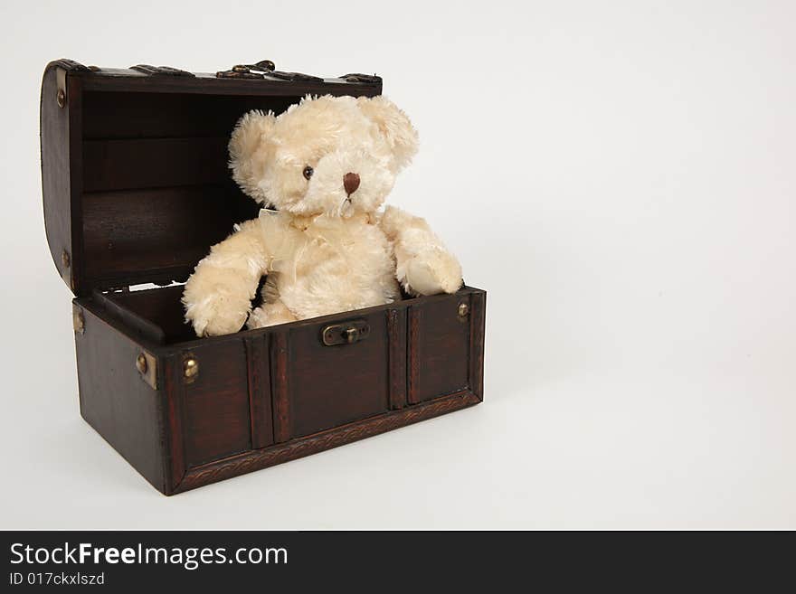 Opened old brown box with teddy as present. Opened old brown box with teddy as present