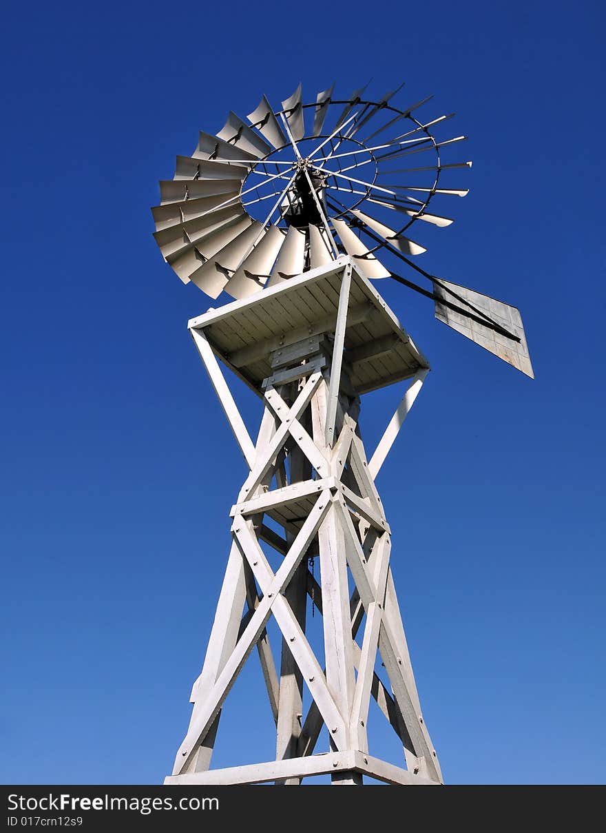 Windmill over blue sky