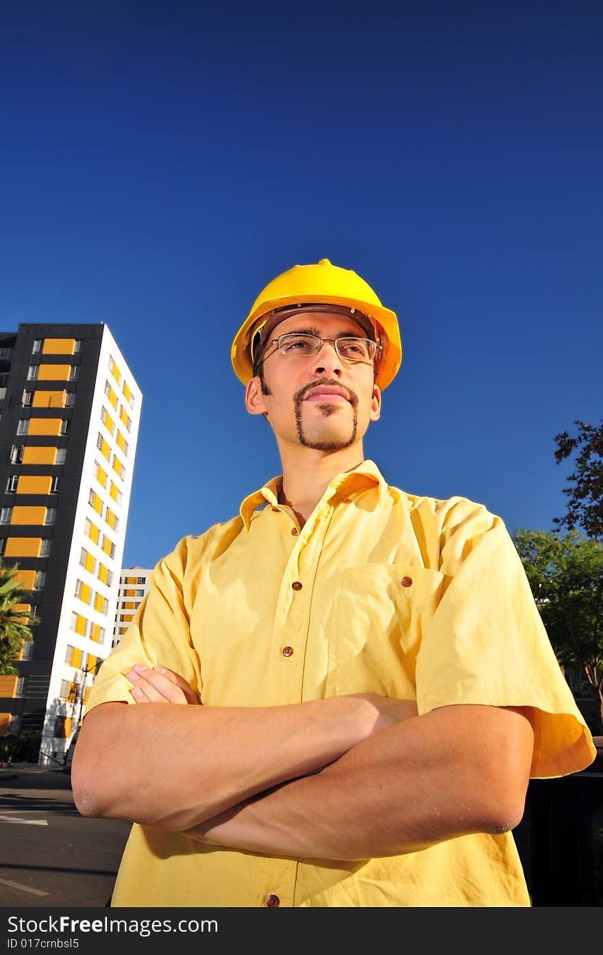 Young architect over blue sky