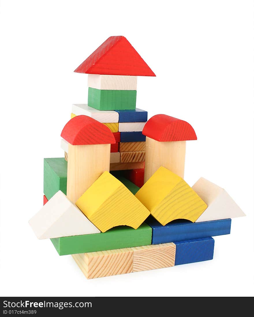 Building from toy wooden cubes on white