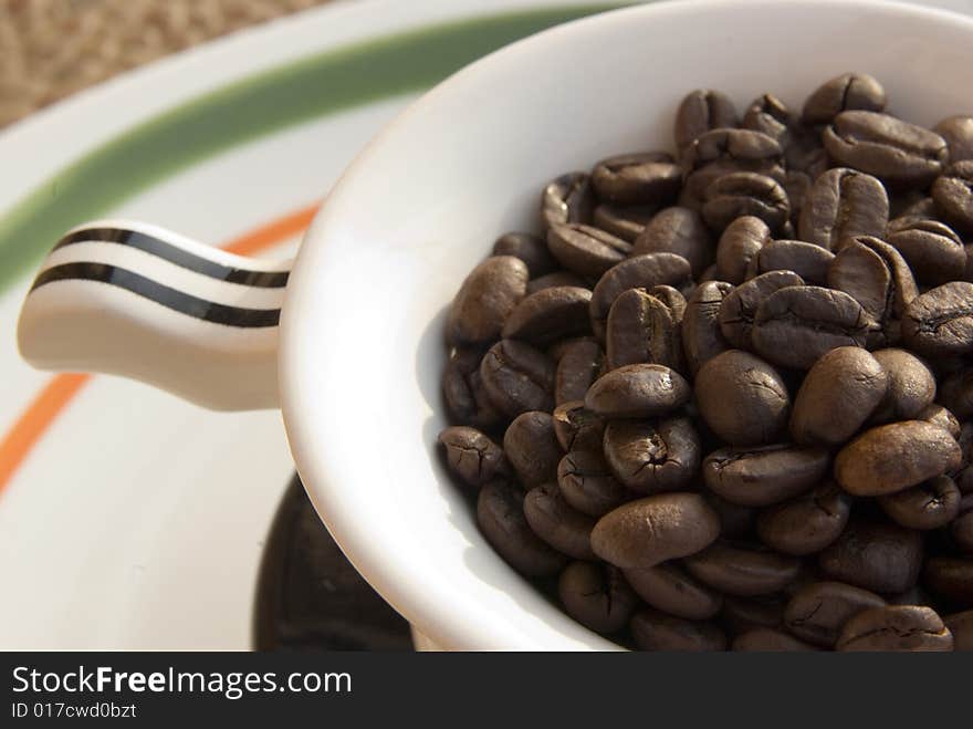 Coffee beans in tea-cup