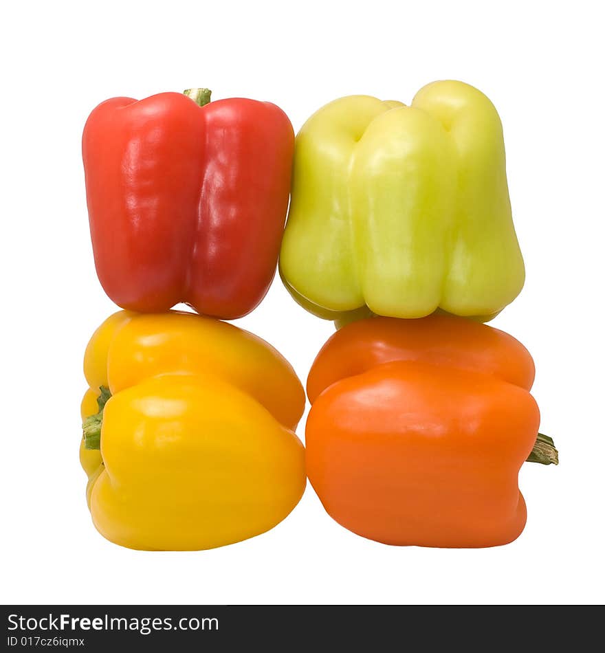 Multicolored peppers isolated on the white background. Multicolored peppers isolated on the white background