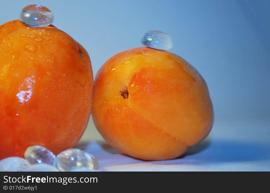 Two apricots with glass decor