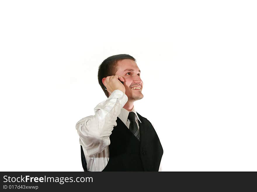 Young man in vest with mobile phone on white. Young man in vest with mobile phone on white