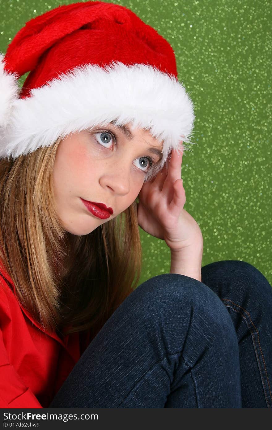 Teenager with red lips wearing a christmas hat. Teenager with red lips wearing a christmas hat