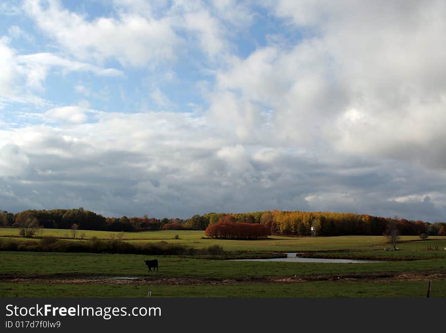 Clouds over a farm pasture in October. Clouds over a farm pasture in October