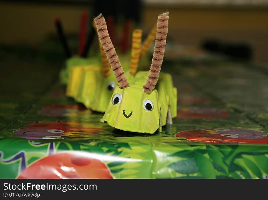 Childs party table decorated with a catepiller