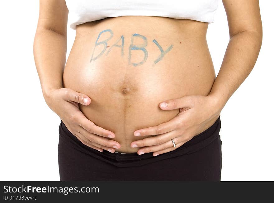 30 weeks pregnant teenager holding her belly with the word baby