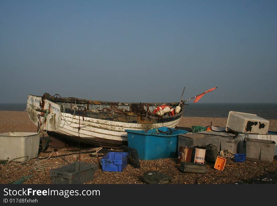 Old fishing boat left on the beach