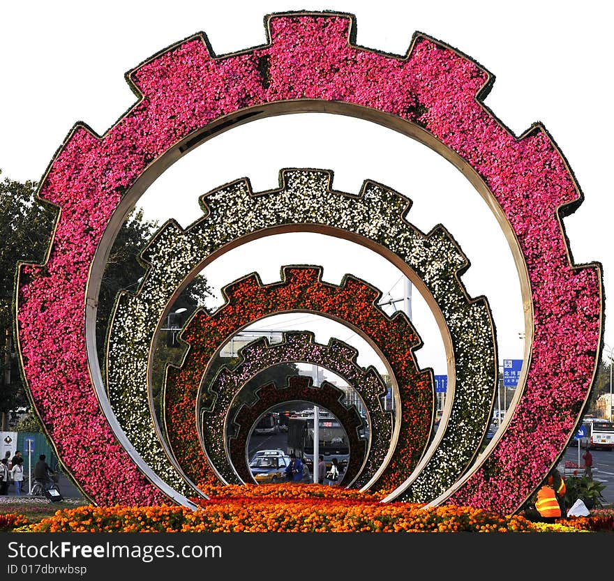 Gardening with flowers, city sculpture with colorful flower