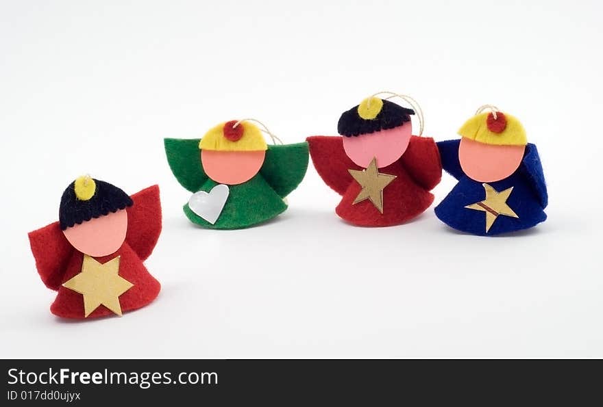 Four christmas figurines on the white background