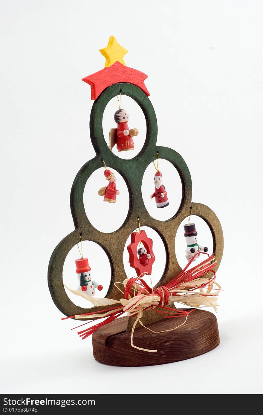 Wooden Christmas tree with figurines on the white background