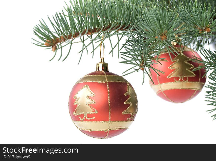 Fir tree branch with decoration on a white background. Close up. Christmas decoration.