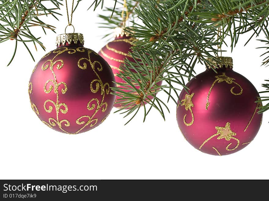 Fir tree branch with decoration on a white background. Close up. Christmas decoration.