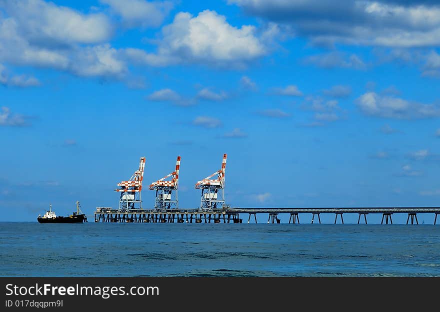 A pire of power station with with three crane