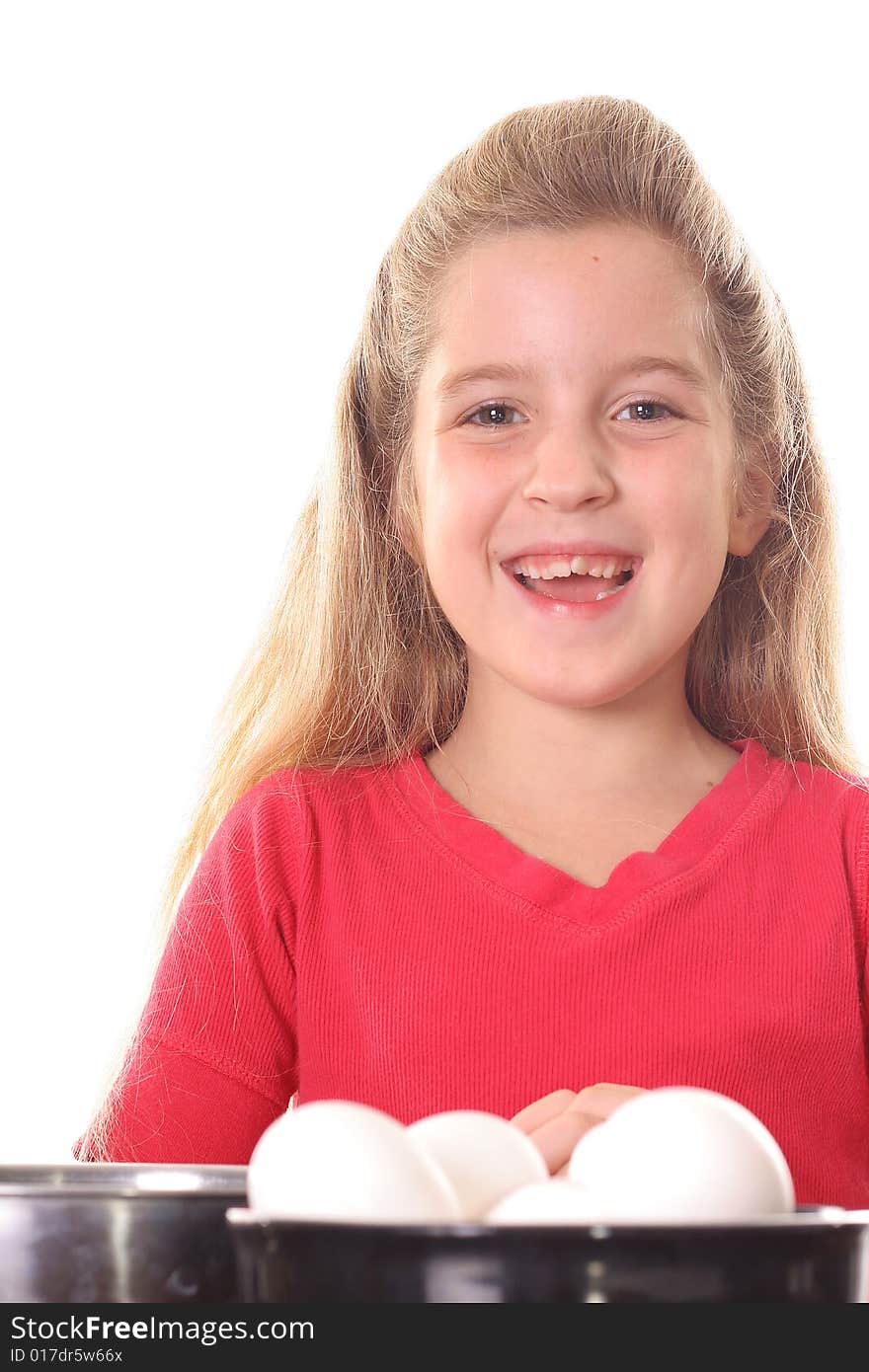 Happy child with eggs isolated on white