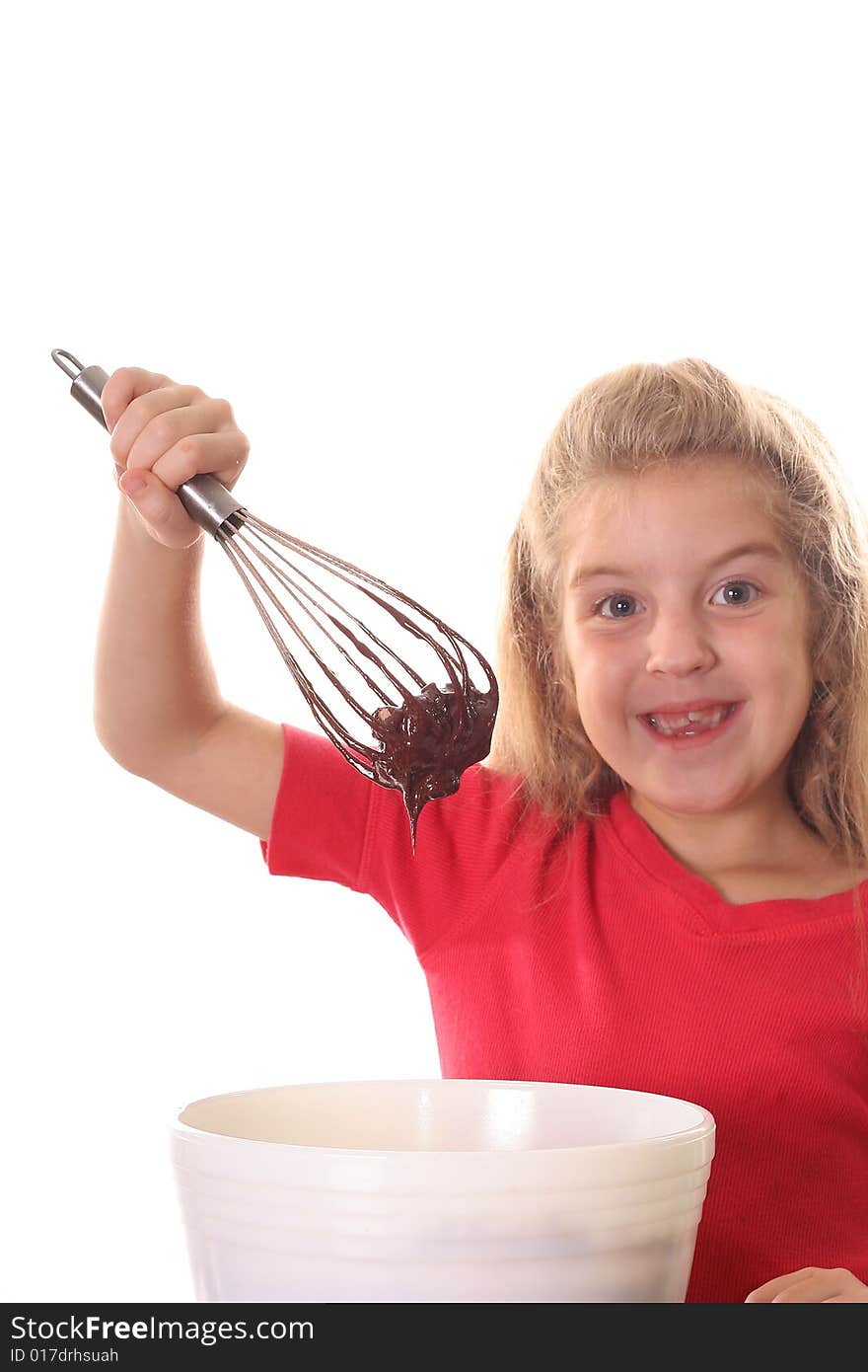 Happy little girl mixing brownie batter vertical