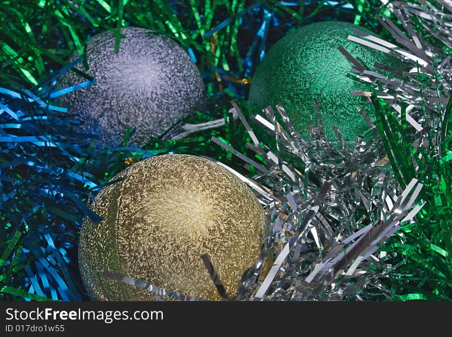 New Year's spheres in a tinsel as eggs in a jack