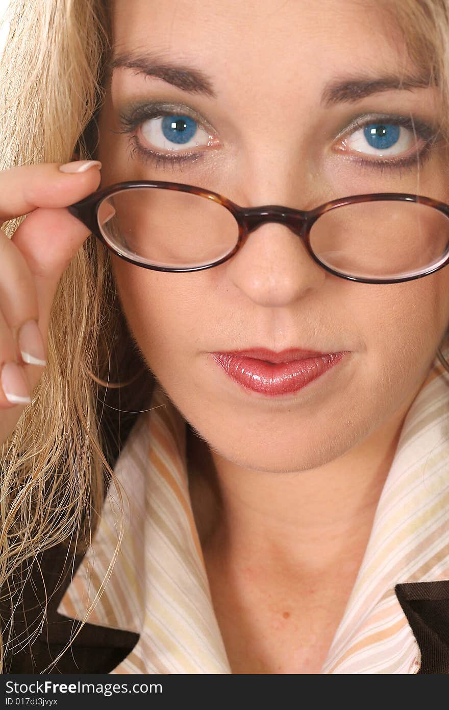 Woman pulling her glasses down - blue eyes