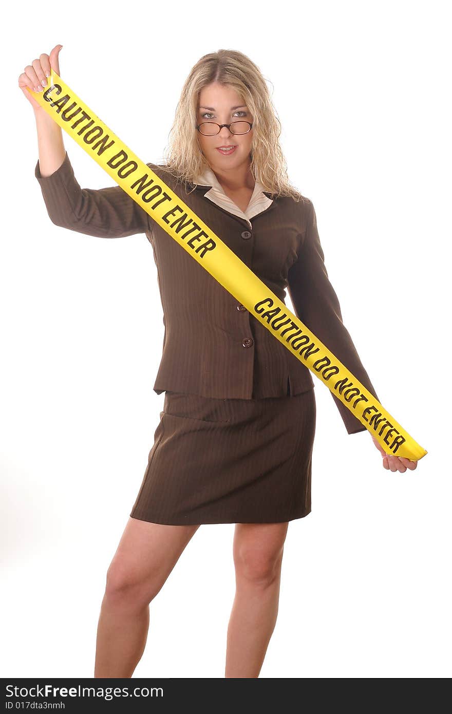 Sexy woman holding caution tape vertical